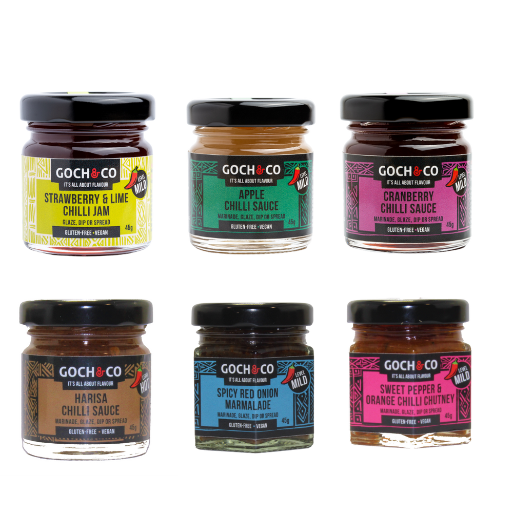 
                  
                    A collection of six jars of Goch & Co's award-winning chilli sauces, jams, and chutney, arranged in a grid layout against a white background.
                  
                